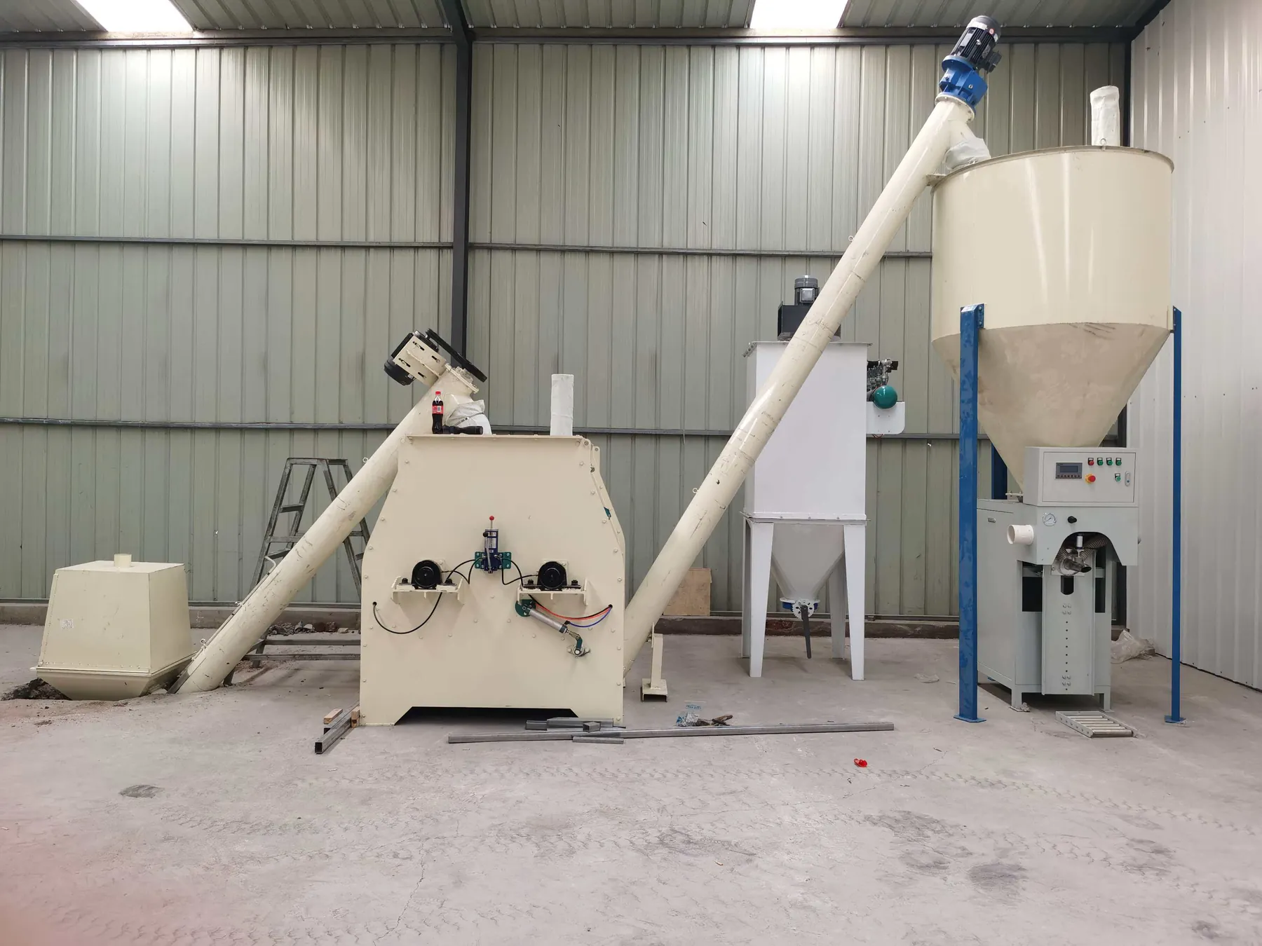 Compact Cronus dry mortar mixer with screw conveyor, storage hopper and packing machine